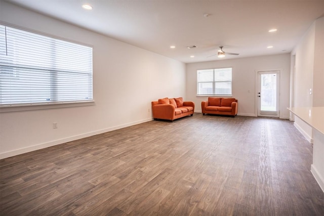 living area with baseboards, recessed lighting, ceiling fan, and wood finished floors
