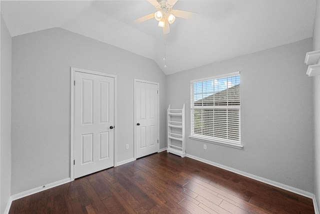 10700 Galsworthy Ln, Austin, TX 78739 - unfurnished bedroom featuring baseboards, a ceiling fan, wood finished floors, and lofted ceiling