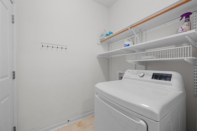 10700 Galsworthy Ln, Austin, TX 78739 - clothes washing area with laundry area, baseboards, and washer / clothes dryer