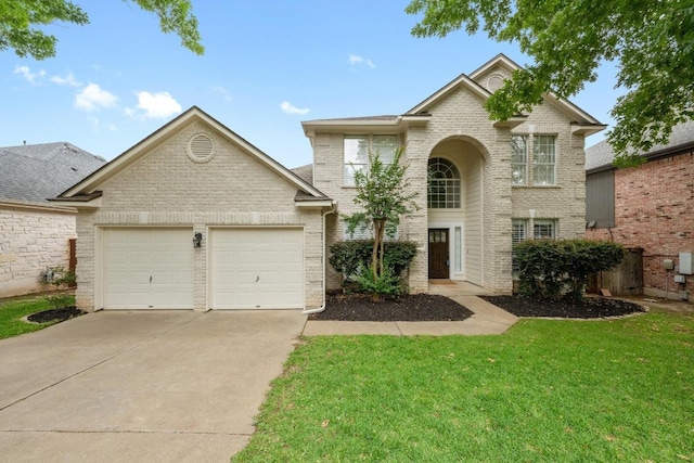 10700 Galsworthy Ln, Austin, TX 78739 - traditional home featuring an attached garage, a front lawn, brick siding, and concrete driveway