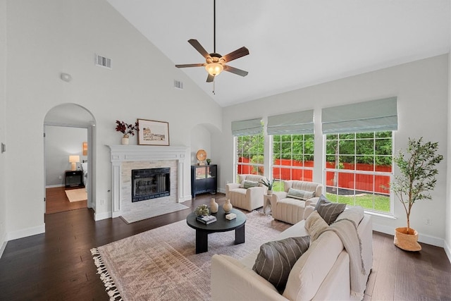 10700 Galsworthy Ln, Austin, TX 78739 - living area featuring arched walkways, high vaulted ceiling, a ceiling fan, wood finished floors, and visible vents