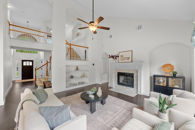 10700 Galsworthy Ln, Austin, TX 78739 - living area with built in features, wood finished floors, high vaulted ceiling, and stairway