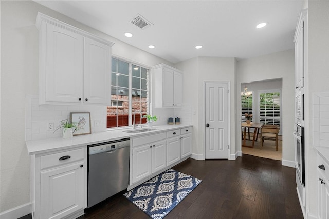 10700 Galsworthy Ln, Austin, TX 78739 - bar with visible vents, tasteful backsplash, a sink, baseboards, and stainless steel appliances