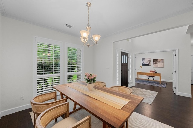 10700 Galsworthy Ln, Austin, TX 78739 - dining space with visible vents, dark wood finished floors, baseboards, a chandelier, and ornamental molding