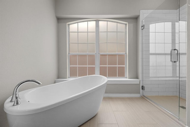 10700 Galsworthy Ln, Austin, TX 78739 - full bathroom featuring a freestanding tub and a shower stall