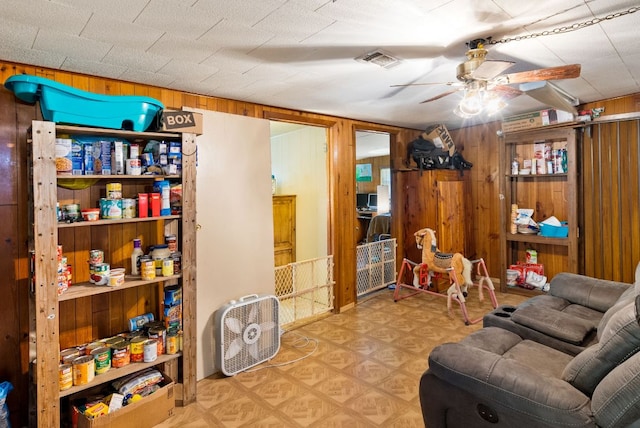 520 Munson St, Tow, TX 78672 - interior space featuring wooden walls, a ceiling fan, and visible vents