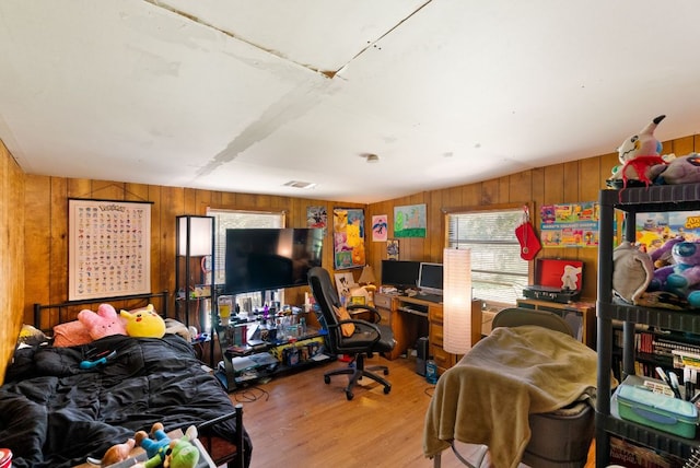 520 Munson St, Tow, TX 78672 - bedroom featuring wooden walls, wood finished floors, and visible vents