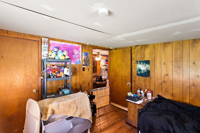 520 Munson St, Tow, TX 78672 - bedroom featuring wood finished floors and wooden walls