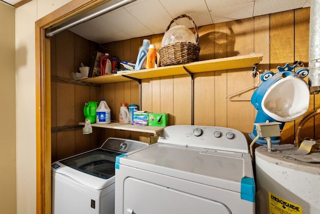 520 Munson St, Tow, TX 78672 - clothes washing area with separate washer and dryer, laundry area, wood walls, and water heater