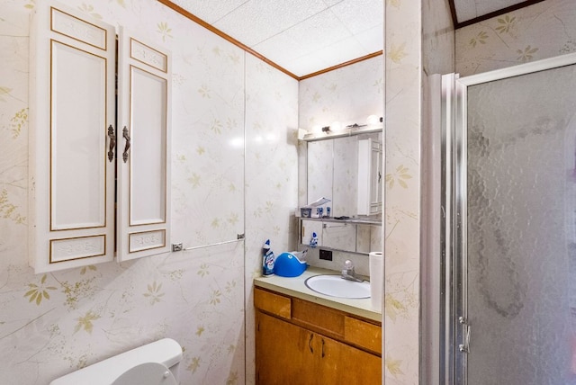 520 Munson St, Tow, TX 78672 - bathroom with vanity, ornamental molding, toilet, wallpapered walls, and a shower stall