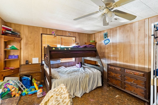 520 Munson St, Tow, TX 78672 - bedroom with wooden walls and a ceiling fan