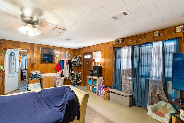 520 Munson St, Tow, TX 78672 - interior space featuring concrete flooring, wood walls, and visible vents