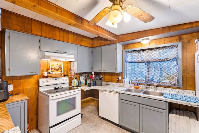 520 Munson St, Tow, TX 78672 - kitchen featuring white appliances, light countertops, under cabinet range hood, a sink, and gray cabinetry
