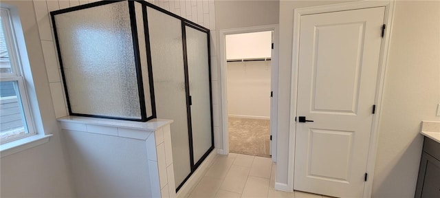 118 Freeman Day Dr, Bastrop, TX 78602 - full bathroom with a stall shower, vanity, tile patterned flooring, and baseboards