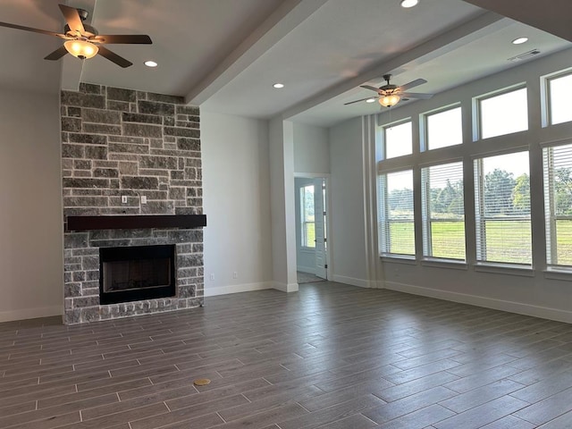 413 Prairie Clover Dr, Dripping Springs, TX 78620 - unfurnished living room with baseboards, a ceiling fan, dark wood-type flooring, and beamed ceiling