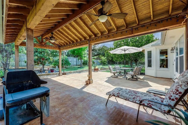 view of patio / terrace featuring a ceiling fan, a grill, a fenced backyard, and outdoor dining space