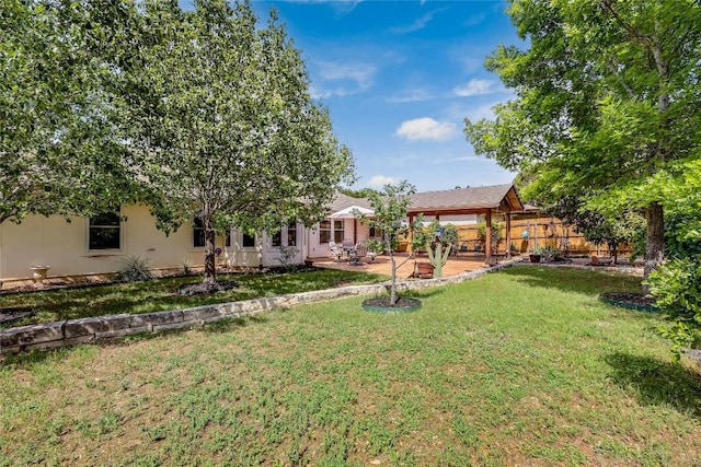 view of yard with a gazebo, a patio area, and fence