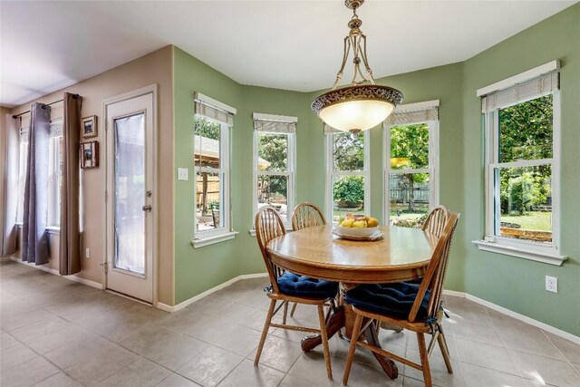 20603 Camel Back St, Lago Vista, TX 78645 - dining room with light tile patterned floors and baseboards