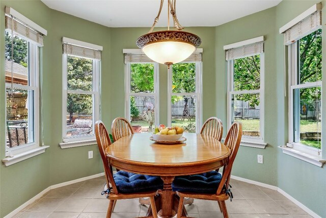 20603 Camel Back St, Lago Vista, TX 78645 - dining room featuring healthy amount of natural light, light tile patterned floors, and baseboards