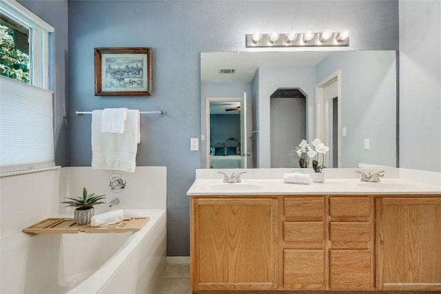 20603 Camel Back St, Lago Vista, TX 78645 - full bathroom with double vanity and a garden tub