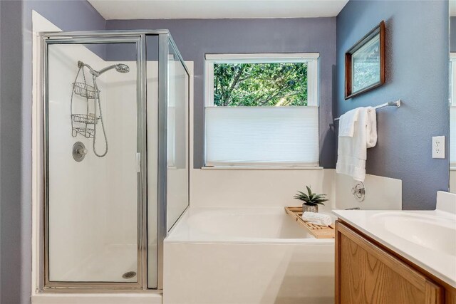 20603 Camel Back St, Lago Vista, TX 78645 - full bathroom with a shower stall, a bath, and vanity