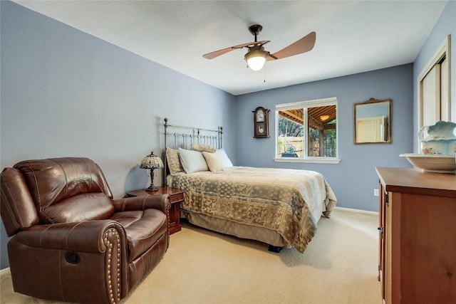 bedroom featuring light colored carpet and ceiling fan
