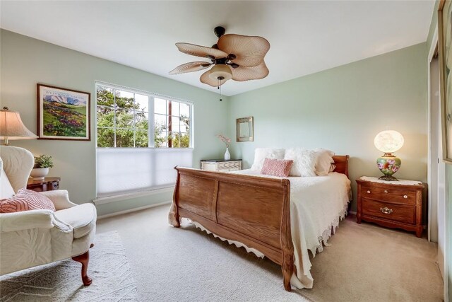 20603 Camel Back St, Lago Vista, TX 78645 - bedroom with light colored carpet, baseboards, and ceiling fan