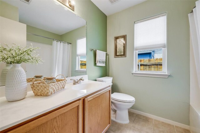 20603 Camel Back St, Lago Vista, TX 78645 - bathroom featuring toilet, vanity, baseboards, tile patterned flooring, and a shower with shower curtain