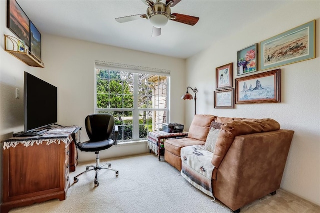 home office featuring light colored carpet and ceiling fan