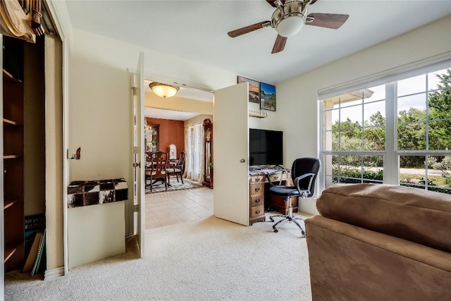 office featuring light colored carpet and ceiling fan
