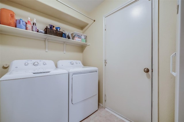 20603 Camel Back St, Lago Vista, TX 78645 - laundry area with washing machine and clothes dryer and light tile patterned flooring