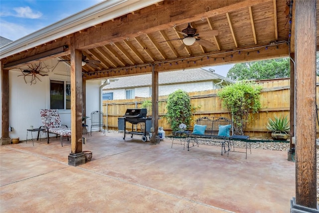 view of patio / terrace with fence, ceiling fan, and grilling area