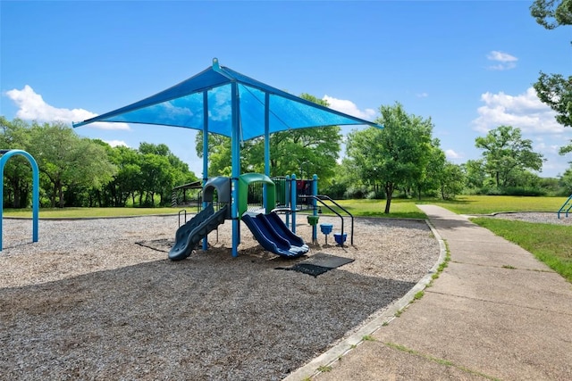 community playground featuring a lawn