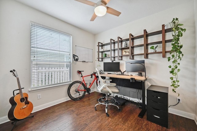 office area featuring baseboards, a ceiling fan, and wood finished floors