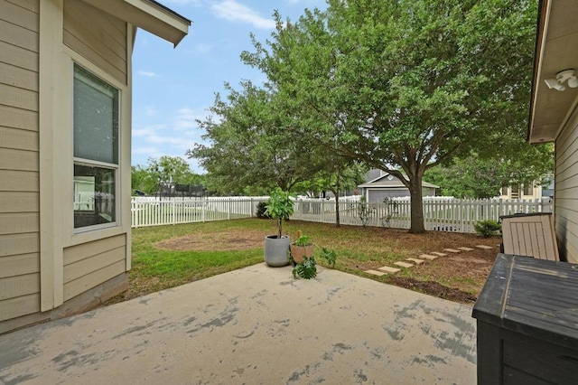 exterior space with a fenced backyard and a patio area