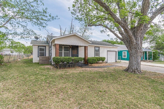 1052 Dunlap Dr, New Braunfels, TX 78130 - view of front of house featuring fence, driveway, a front yard, and a garage
