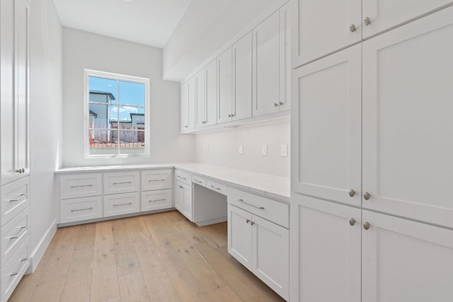 6013 Silver Luna Way, Austin, TX 78738 - unfurnished office featuring built in desk and light wood-style floors