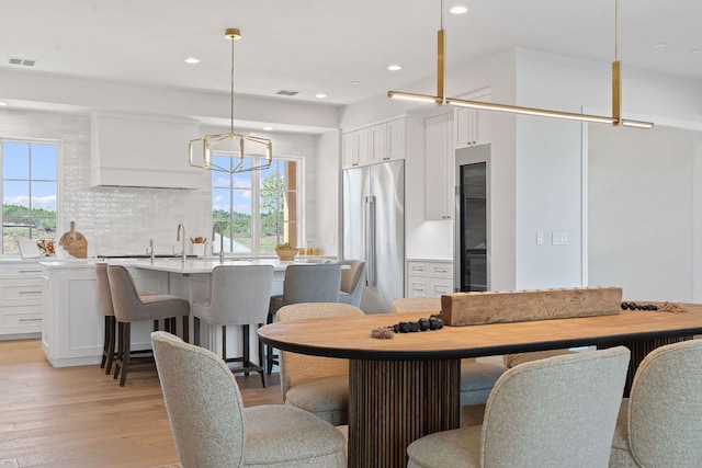6013 Silver Luna Way, Austin, TX 78738 - dining room featuring light wood-style floors and recessed lighting