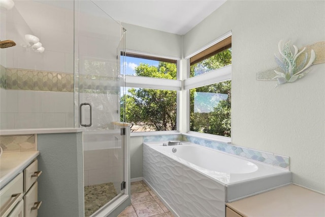 full bathroom with vanity, tile patterned floors, a bath, and a shower stall