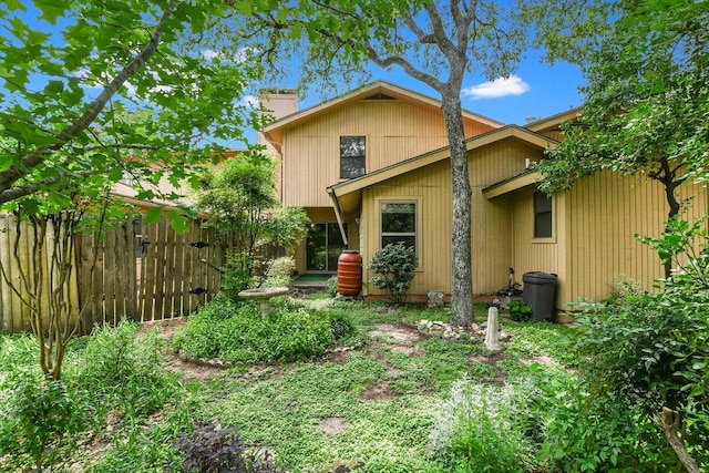 8518 Fathom Cir Unit 107, Austin, TX 78750 - back of house with a chimney