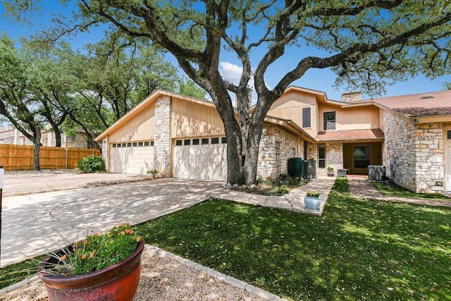 8518 Fathom Cir Unit 107, Austin, TX 78750 - mid-century home featuring stone siding, concrete driveway, and an attached garage