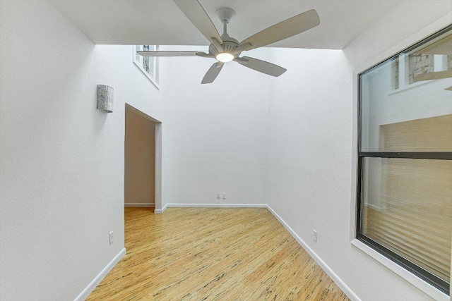 8518 Fathom Cir Unit 107, Austin, TX 78750 - empty room with wood finished floors, ceiling fan, and baseboards