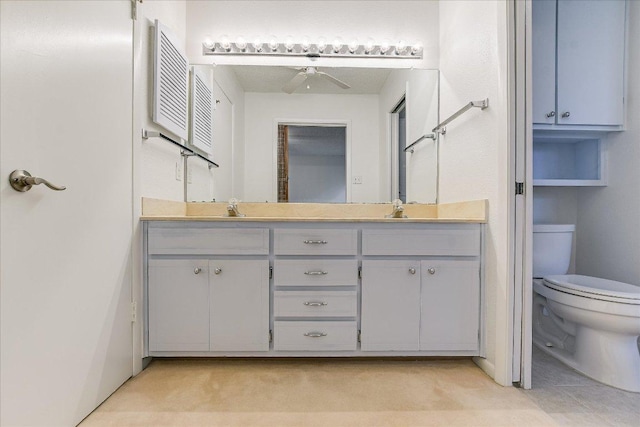 8518 Fathom Cir Unit 107, Austin, TX 78750 - bathroom featuring double vanity, a ceiling fan, toilet, and tile patterned flooring