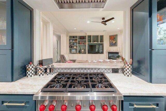 3705 Dogwood Creek Cv, Austin, TX 78746 - kitchen featuring blue cabinets, ceiling fan, range, fridge, and light countertops