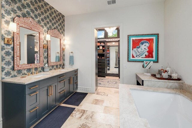 3705 Dogwood Creek Cv, Austin, TX 78746 - full bathroom featuring double vanity, a bath, and a chandelier