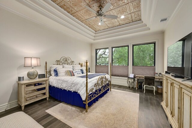 3705 Dogwood Creek Cv, Austin, TX 78746 - bedroom featuring a tray ceiling, dark wood-type flooring, crown molding, and an office area