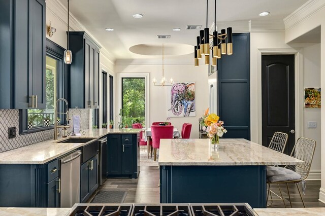 3705 Dogwood Creek Cv, Austin, TX 78746 - kitchen with stainless steel dishwasher, dark wood-style flooring, a kitchen bar, a chandelier, and decorative backsplash