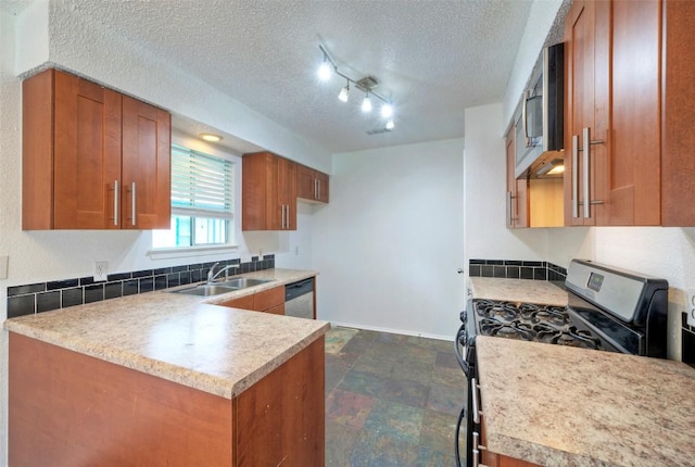 kitchen featuring a sink, light countertops, a textured ceiling, brown cabinetry, and stainless steel appliances