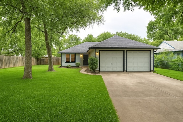 ranch-style home with driveway, roof with shingles, a garage, fence, and a front lawn