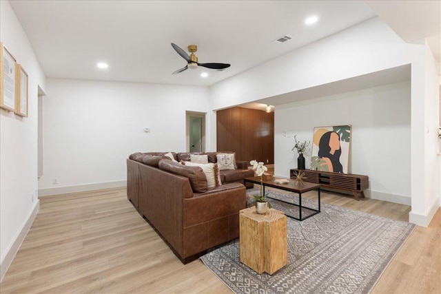 living area with visible vents, light wood-style floors, baseboards, ceiling fan, and recessed lighting